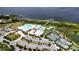 Spacious community pool, tennis courts, and ample parking near the lake at 4904 W Fountainwood Dr, St Cloud, FL 34772