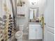 Cozy bathroom featuring shower/tub combo, decorative mirror, and white vanity at 4904 W Fountainwood Dr, St Cloud, FL 34772