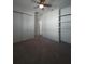 Simple bedroom with carpet, fan, and built in shelves at 4904 W Fountainwood Dr, St Cloud, FL 34772
