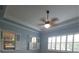 Bedroom featuring a ceiling fan, white trim, and two windows at 4904 W Fountainwood Dr, St Cloud, FL 34772