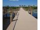 A long wooden boardwalk passes over the water and connects community amenities at 4904 W Fountainwood Dr, St Cloud, FL 34772