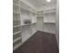 Walk-in closet with custom shelving and ample storage space at 4904 W Fountainwood Dr, St Cloud, FL 34772