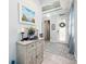 Stylish foyer featuring a decorative cabinet, elegant decor, and a welcoming front door at 4904 W Fountainwood Dr, St Cloud, FL 34772