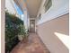 Covered front porch featuring tiled flooring, neutral wall colors, and decorative door at 4904 W Fountainwood Dr, St Cloud, FL 34772
