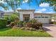 Charming home featuring manicured front yard and attached two-car garage at 4904 W Fountainwood Dr, St Cloud, FL 34772