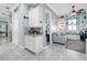 Bright hallway featuring built-in shelving, a cozy sitting area, and modern finishes at 4904 W Fountainwood Dr, St Cloud, FL 34772
