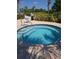 A community hot tub is surrounded by brick pavers and lush landscaping at 4904 W Fountainwood Dr, St Cloud, FL 34772