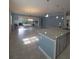 Open concept kitchen and living room with a sliding glass doors to a screened patio at 4904 W Fountainwood Dr, St Cloud, FL 34772
