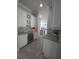 Wet bar area with white cabinets, tile backsplash, granite countertop and wine refrigerator at 4904 W Fountainwood Dr, St Cloud, FL 34772