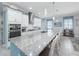 Well-equipped kitchen with sleek countertops, white cabinetry and stainless-steel appliances at 4904 W Fountainwood Dr, St Cloud, FL 34772
