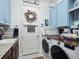 Well-organized laundry room with updated appliances at 4904 W Fountainwood Dr, St Cloud, FL 34772