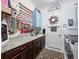 Functional laundry room with ample storage and modern appliances at 4904 W Fountainwood Dr, St Cloud, FL 34772
