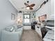 Spacious home office with custom built-ins, desk, and comfortable seating at 4904 W Fountainwood Dr, St Cloud, FL 34772