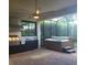 Screened-in patio featuring a grill and hot tub at 4904 W Fountainwood Dr, St Cloud, FL 34772