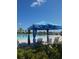 Resort-style pool with ample seating, umbrellas, and lush tropical plants at 4904 W Fountainwood Dr, St Cloud, FL 34772