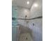 Modern shower with gray tiling and a built-in niche at 4904 W Fountainwood Dr, St Cloud, FL 34772