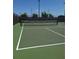 Community tennis court with a net and tall lighting for evening play at 4904 W Fountainwood Dr, St Cloud, FL 34772