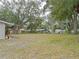 Large backyard with mature trees at 1708 Nebraska Ave, Kissimmee, FL 34744