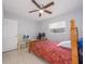 Bedroom with wood bed frame and ceiling fan at 1708 Nebraska Ave, Kissimmee, FL 34744