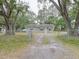 House exterior with a chain link fence and driveway at 1708 Nebraska Ave, Kissimmee, FL 34744