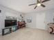 Living room with tiled floors, piano, and comfy seating at 1708 Nebraska Ave, Kissimmee, FL 34744