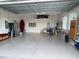 Spacious garage with epoxy floors and storage shelves at 3962 Kennebunk Loop, Mount Dora, FL 32757