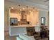 Beautiful kitchen featuring stainless steel appliances, ample counter space, and seamless integration with the living area at 3962 Kennebunk Loop, Mount Dora, FL 32757
