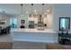 Kitchen featuring a large island, stainless appliances, and modern pendant lighting at 3962 Kennebunk Loop, Mount Dora, FL 32757