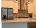Gourmet kitchen with stainless steel appliances, modern countertops, and ample cabinet space at 3962 Kennebunk Loop, Mount Dora, FL 32757