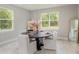 Bright dining room with large windows and stylish table and chairs at 12365 Sw 54Th Lane Rd, Ocala, FL 34481