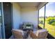 Cozy screened patio featuring comfortable seating and view of the backyard at 2747 San Marco Way, Winter Haven, FL 33884