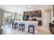 Open kitchen featuring large island, stainless steel appliances, and modern finishes at 2755 San Marco Way, Winter Haven, FL 33884
