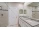 Double vanity bathroom with shower and granite at 1445 General Mac Arthur Ave, Daytona Beach, FL 32114