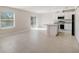 Open concept kitchen with island and backyard access at 1445 General Mac Arthur Ave, Daytona Beach, FL 32114