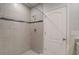 Large walk-in shower with neutral tile at 1445 General Mac Arthur Ave, Daytona Beach, FL 32114