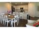 Eat-in kitchen and dining room with abundant natural light and a view of the stylish kitchen island at 7367 Catania Loop, Clermont, FL 34714
