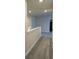 Upstairs hallway with neutral carpeting and light paint at 7367 Catania Loop, Clermont, FL 34714