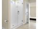 Large shower with glass doors and neutral tile at 7367 Catania Loop, Clermont, FL 34714