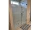 Modern shower with glass enclosure and neutral tile at 7367 Catania Loop, Clermont, FL 34714