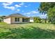 Expansive backyard featuring lush green grass, perfect for outdoor activities and enjoying the serene surroundings at 4223 Arlington Ridge Blvd, Leesburg, FL 34748