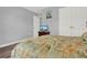 Cozy bedroom with a lush green bedspread, perfect for relaxation at 4223 Arlington Ridge Blvd, Leesburg, FL 34748