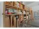 Organized garage featuring ample shelving to accommodate storage needs, enhancing functionality and space utilization at 4223 Arlington Ridge Blvd, Leesburg, FL 34748