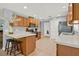 Modern kitchen with barstool seating, stainless steel appliances, and bright, natural lighting at 4223 Arlington Ridge Blvd, Leesburg, FL 34748