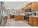 Open kitchen with stainless steel appliances, modern cabinetry, and a cozy breakfast nook at 4223 Arlington Ridge Blvd, Leesburg, FL 34748