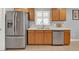 Modern kitchen with stainless steel appliances and light wood cabinets at 4223 Arlington Ridge Blvd, Leesburg, FL 34748