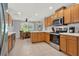 Modern kitchen with stainless steel appliances and light wood cabinets at 4223 Arlington Ridge Blvd, Leesburg, FL 34748