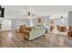 Spacious living room with wood-look floors and comfy sofas at 4223 Arlington Ridge Blvd, Leesburg, FL 34748