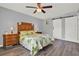 Bright bedroom showcasing a decorative barn door and ample natural light at 4223 Arlington Ridge Blvd, Leesburg, FL 34748