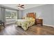 Bright main bedroom with a ceiling fan, offering comfort and style at 4223 Arlington Ridge Blvd, Leesburg, FL 34748