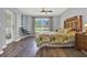 Main bedroom with backyard view and access to lanai/patio area at 4223 Arlington Ridge Blvd, Leesburg, FL 34748